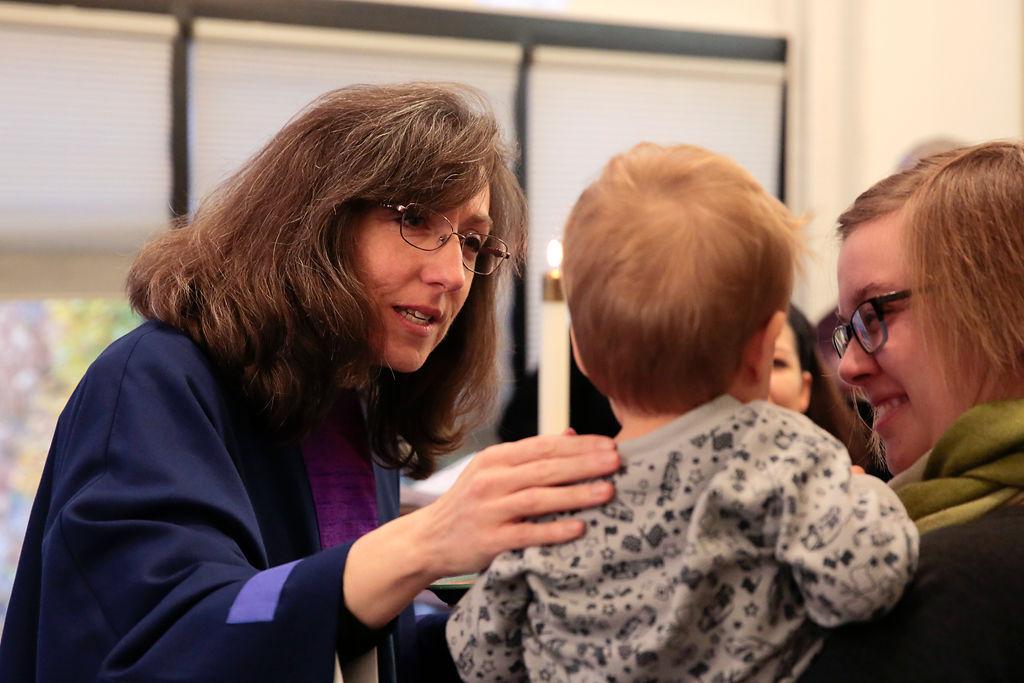 Pastor Cathy gives blessings to Oliver Rausch